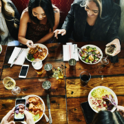 sharing-lunch-in-restaurant-928010348-5b4abe8f46e0fb003712c478